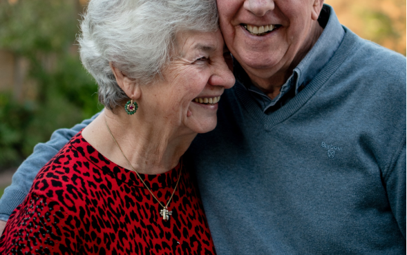 Happy elderly couple, the man is wearing glasses