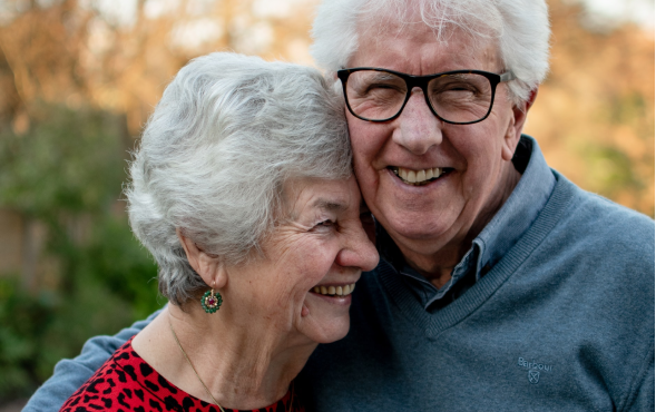 Happy elderly couple, the man is wearing glasses
