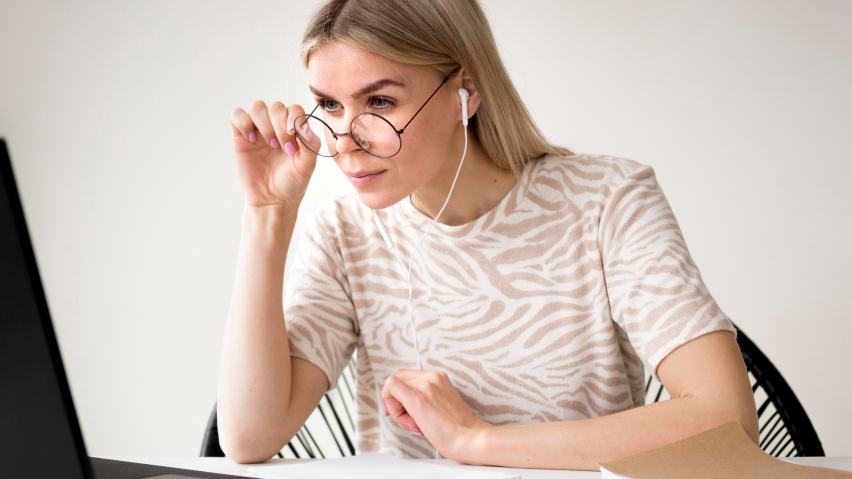 woman-adjusting-her-reading-glasses